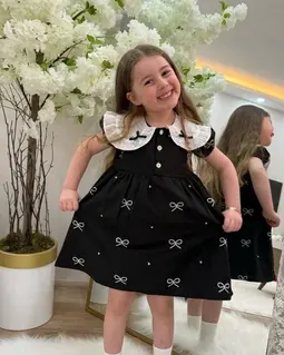 پیراهن دخترانه مشکی طرح پاپیونی سفید