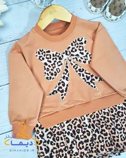 پیراهن دورس پنککی پاپیونی طرح دامن پلیسه پلنگی