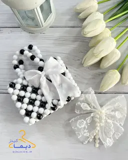 کیف دستی سفید مشکی طرح مرواریدی پاپیون سفید