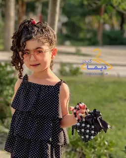 کیف دستی مشکی سفید طرح مرواریدی پاپیونی مشکی
