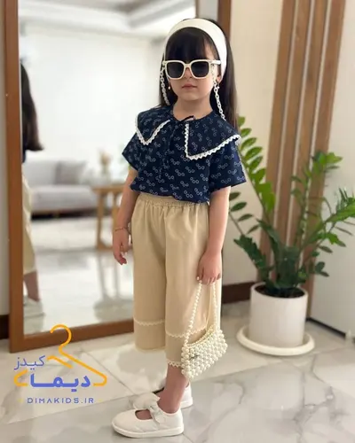 ست شومیز و شلوارک کرم سرمه ای طرح یقه ملوانی