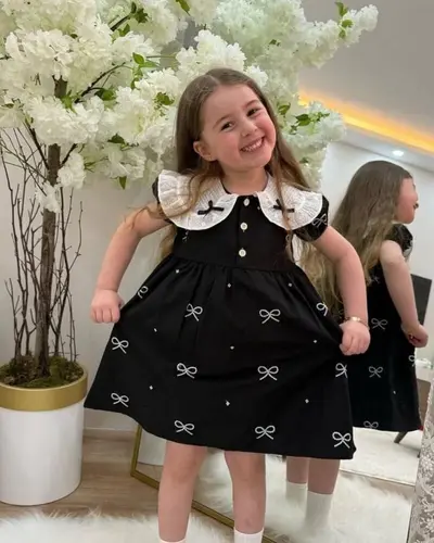 پیراهن دخترانه مشکی طرح پاپیونی سفید