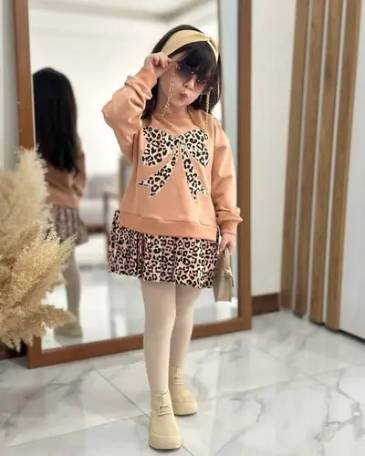 پیراهن دورس پنککی پاپیونی طرح دامن پلیسه پلنگی